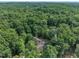 A beautiful aerial view shows a lush green landscape surrounding this charming home at 8510 Dunlee Falls Rd, Raleigh, NC 27613