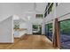 Bright living room with hardwood floors, high ceilings, and sliding doors to an outdoor deck at 8510 Dunlee Falls Rd, Raleigh, NC 27613