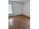 Bedroom featuring laminate floors and natural light from the window at 903 New Bern Ave, Raleigh, NC 27601