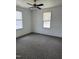 Bedroom featuring carpeting and natural light from two windows at 903 New Bern Ave, Raleigh, NC 27601