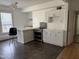Kitchen with white cabinets, tile backsplash, and modern appliances at 903 New Bern Ave, Raleigh, NC 27601