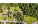An aerial view shows the home situated on a spacious lot with mature trees at 918 Circle Dr, Angier, NC 27501