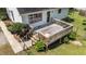 Aerial close up of deck with light wood, railing and stairs to yard at 918 Circle Dr, Angier, NC 27501