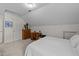 Attic bedroom with carpet, neutral walls, slanted ceilings, a ceiling light, and a vintage dresser at 918 Circle Dr, Angier, NC 27501