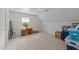 Bright bonus room with plush carpeting, window desk nook, and ample storage space at 918 Circle Dr, Angier, NC 27501