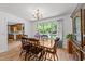 Dining room with hardwood floors, a window, chandelier, and a dining table with six chairs at 918 Circle Dr, Angier, NC 27501