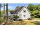 Side view of a charming single-story home with a landscaped yard and mature trees at 918 Circle Dr, Angier, NC 27501
