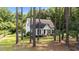 Beautiful single-story home with a manicured lawn surrounded by mature trees at 918 Circle Dr, Angier, NC 27501