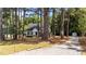 Beautiful single-story home with a long driveway surrounded by mature trees at 918 Circle Dr, Angier, NC 27501