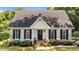 Charming single-story home with a manicured lawn and beautiful landscaping at 918 Circle Dr, Angier, NC 27501