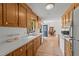 Kitchen features a view into the dining room, wooden cabinets, and white appliances at 918 Circle Dr, Angier, NC 27501
