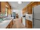 Functional kitchen offering a view of the dining area, complete with wooden cabinets and white countertops at 918 Circle Dr, Angier, NC 27501