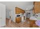 Well-maintained kitchen with wood cabinets, laminate floors, and a practical layout at 918 Circle Dr, Angier, NC 27501