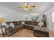 A spacious living room with wood floors, and a large comfortable couch at 918 Circle Dr, Angier, NC 27501