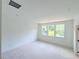 Bedroom with three large windows allowing for lots of natural light and hardwood floors at 1007 Regalia Rd # 31, Durham, NC 27713