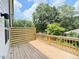 View of private outdoor deck with wood flooring and modern wood paneling and railing at 1007 Regalia Rd # 31, Durham, NC 27713