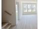 Bright open-concept living room featuring large windows and hardwood flooring at 1007 Regalia Rd # 31, Durham, NC 27713