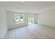 Spacious living room with sliding glass doors that lead to a deck and a window with a view at 1007 Regalia Rd # 31, Durham, NC 27713