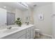 Bathroom featuring double sinks, vanity with white countertop, and framed mirror at 109 Grey Elm Trl, Durham, NC 27713