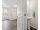 Inviting entryway leads past a half bath with pedestal sink at 109 Grey Elm Trl, Durham, NC 27713