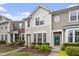 A sunny multi-story townhome with landscaped front yard and an inviting, bright exterior at 109 Grey Elm Trl, Durham, NC 27713