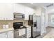 Well-equipped kitchen featuring stainless steel appliances and white cabinets at 109 Grey Elm Trl, Durham, NC 27713