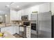 Bright, clean kitchen with stainless steel appliances and granite countertops at 109 Grey Elm Trl, Durham, NC 27713