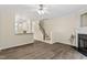 Bright living room featuring stairs and a view into the kitchen at 109 Grey Elm Trl, Durham, NC 27713