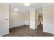 Open floorplan with fresh paint, wood floors and modern lighting at 109 Grey Elm Trl, Durham, NC 27713