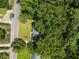 Aerial view of home with lush, mature trees surrounding property at 111 Lattimore Ln, Durham, NC 27713
