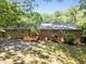 Charming backyard features a wooden deck, brick exterior, and serene landscaping at 111 Lattimore Ln, Durham, NC 27713
