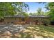 A private backyard is partially shaded with a wood deck accessible through sliding glass doors at 111 Lattimore Ln, Durham, NC 27713