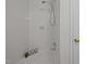 Bright tub and shower with fresh white tile at 111 Lattimore Ln, Durham, NC 27713
