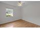 Bright bedroom with hardwood floors featuring a window for natural light at 111 Lattimore Ln, Durham, NC 27713
