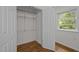 Walk-in closet with ample shelving, hanging space and hardwood floors at 111 Lattimore Ln, Durham, NC 27713