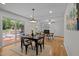 Dining room with a view of the backyard, leading into the living room and kitchen at 111 Lattimore Ln, Durham, NC 27713