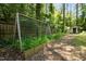Well-maintained backyard garden with raised beds, providing a serene outdoor space for gardening enthusiasts at 111 Lattimore Ln, Durham, NC 27713