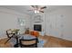 Cozy living room featuring a brick fireplace, hardwood floors, and stylish furnishings at 111 Lattimore Ln, Durham, NC 27713
