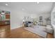 Bright living room with a glimpse of kitchen, perfect for modern living and entertaining guests at 111 Lattimore Ln, Durham, NC 27713