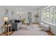 Stylish living room with modern furniture, decor, and a large window, ideal for relaxing or entertaining guests at 111 Lattimore Ln, Durham, NC 27713