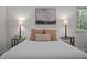 Main bedroom featuring a comfortable bed with decorative pillows and side tables with lamps at 111 Lattimore Ln, Durham, NC 27713
