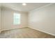 Cozy bedroom with carpet, neutral walls, and a window, offering a comfortable living space at 114 Seastone St, Raleigh, NC 27603