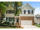 Charming two-story home with a well-maintained yard and a two-car garage at 114 Seastone St, Raleigh, NC 27603