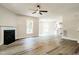 Cozy living room showcasing wood floors, a fireplace, and access to the kitchen at 114 Seastone St, Raleigh, NC 27603