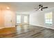 Spacious living room featuring luxury vinyl flooring, neutral paint and lots of light at 114 Seastone St, Raleigh, NC 27603