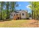 Backyard of the house showing the back porch and stairs at 121 Quarterhorse Dr, Louisburg, NC 27549