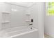 Bathroom with white shower and shelves, window, and bronze hardware at 121 Quarterhorse Dr, Louisburg, NC 27549