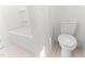 Bathroom featuring a white toilet, white tub, and tiled floor at 121 Quarterhorse Dr, Louisburg, NC 27549