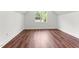 Bedroom featuring hardwood floors and a window offering natural light at 121 Quarterhorse Dr, Louisburg, NC 27549