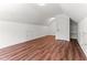Upstairs bonus room featuring hardwood floors and a storage closet at 121 Quarterhorse Dr, Louisburg, NC 27549